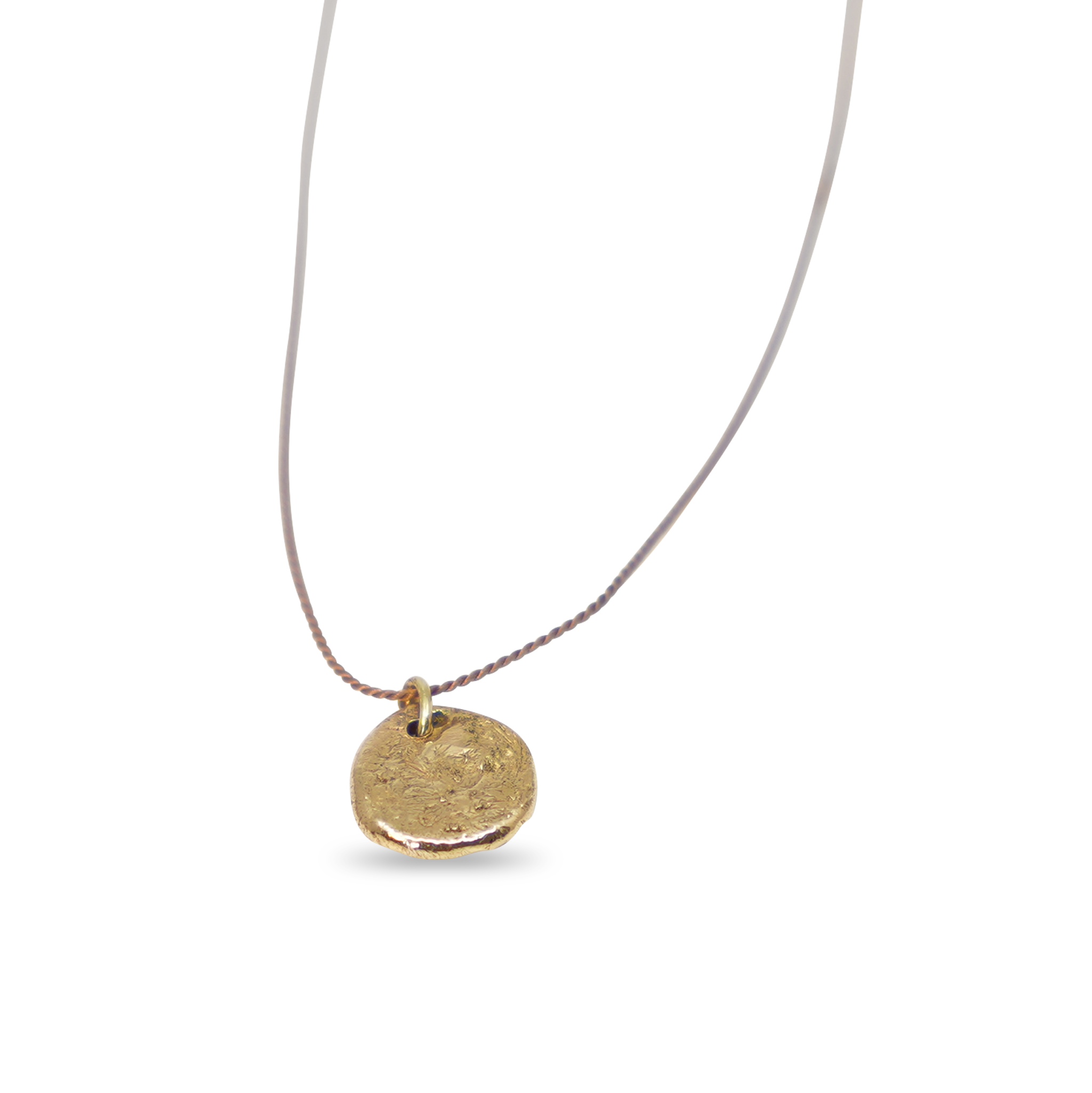 Gouden klompje aan zijden draad